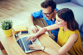 A couple at a laptop
