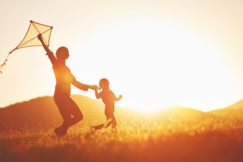 Woman and child with a kite