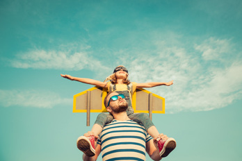 A kid on an adults shoulders